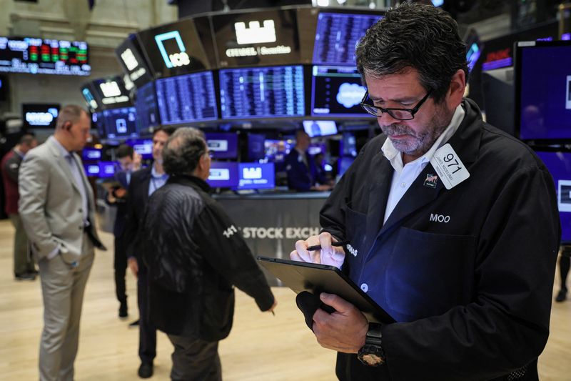 Amid US Fed meeting, Wall Street ends higher after choppy session; S&P 500 banks gain 2%