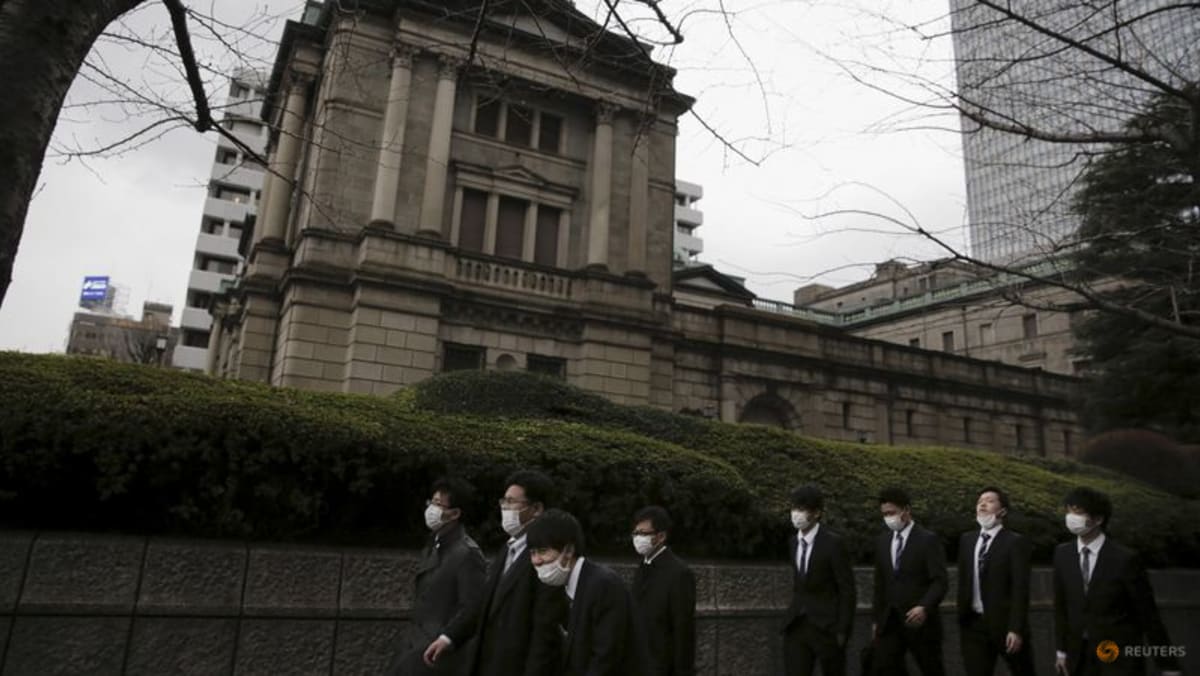 BOJ raises price outlook but maintains ultra-easy policy