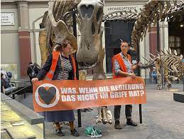 Climate activists glue themselves to dinosaur exhibit at Berlin museum